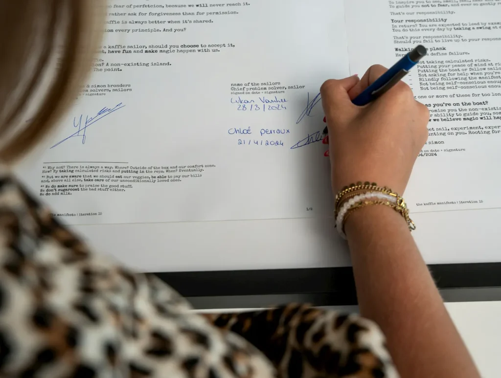 Woman signing a contract at a desk